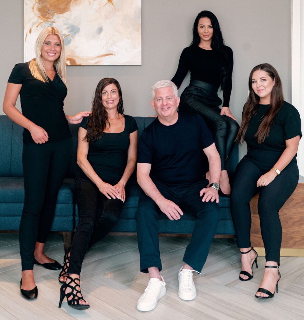 The Elle staff sitting in a beautiful lobby area