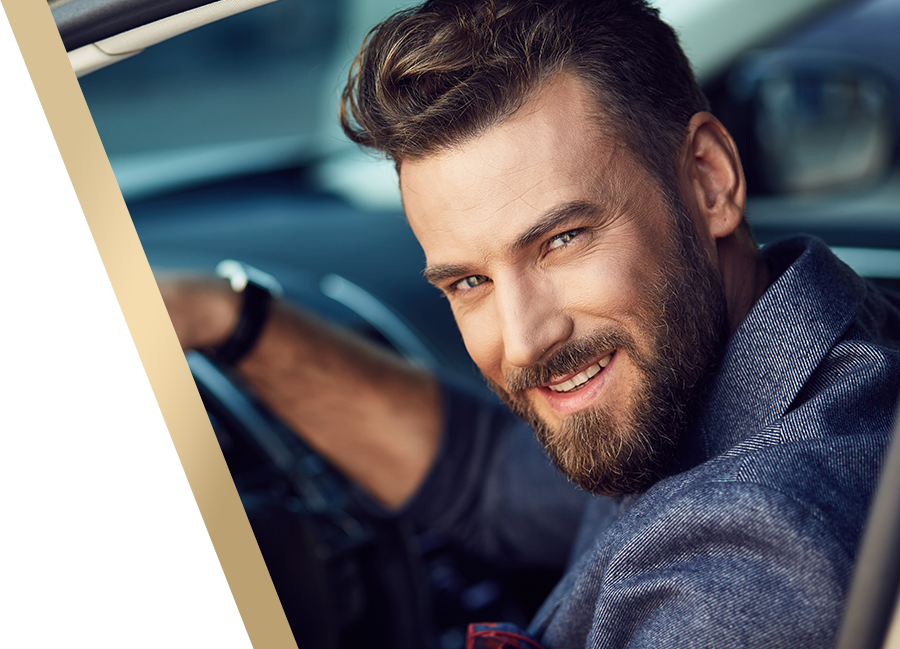 happy healthy confident man driving his car